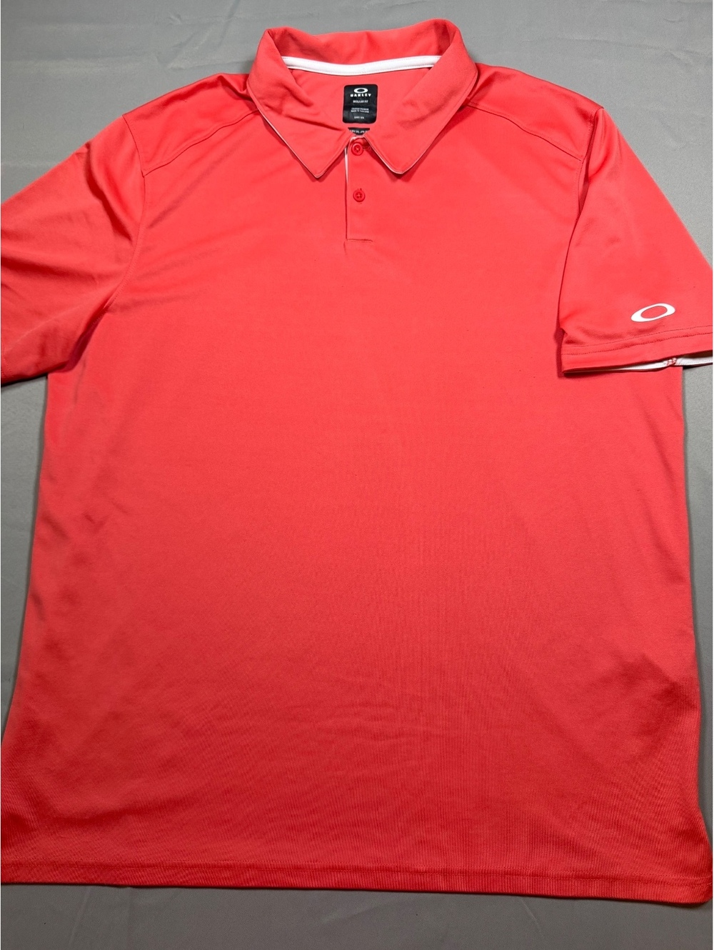 Oakley coral polo shirt